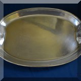 S16. Metal platter with shell shaped handles. 21” x 13” - $32 